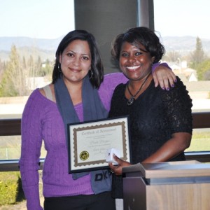 Every year, Director of Sales Arisha Williams (r) presents the Renoir staff with an award based on which Renoir value the staff member has demonstrated the past year. Here's Staffing Associate Marlo Morgan receiving the award for Positivity!
